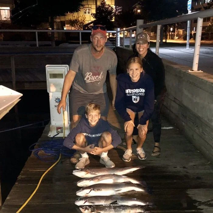 Photo of family with several fish they caught
