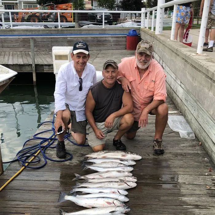 Photo of friends with several fish they caught
